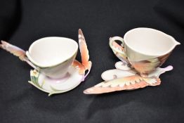 Two modern Franz tea cup and saucer sets with butterfly designs both with boxes