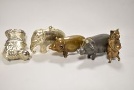 A selection of antique novelty animal form vesta cases including two standing pigs, a piglet sat
