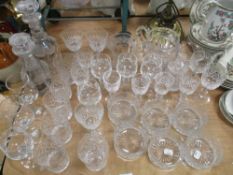 A selection of cut-crystal glasswares, tumblers, wine glasses, jug, to include two decanters
