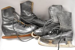 Two pairs of early 20th century ice skates both with leather boots