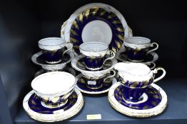 A 20th century Aynsley part tea service in gilt and cobalt blue