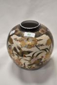 A modern Japanese Satsuma ware ginger jar decorated with birds of paradise and crackle glaze