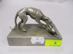 An Art Deco cast metal study of a greyhound with rabbit in mouth.