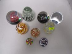 A collection of paperweights including Caithness and millefiori.