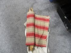 A Vintage Mid Century striped material wind breaker, with poles and carry bag