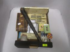 A selection of vintage curios and trinkets including card games, cigarette cases and a police
