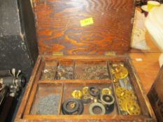 A box of assorted Meccano fixtures and fittings including a clock work motor