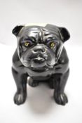An early 20th century English ceramic figure of a Bull dog seated