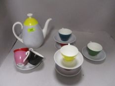 An Adderley 'Fiesta' pattern part coffee set, two cups cracked, two saucers missing