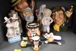 A selection of figures and Royal Doulton character mugs including Punch and Judy man and Gondolier