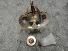 An early 20th century Arts and Crafts style ceiling light pendant with copper body and opaque