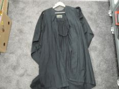 A vintage university gown marked Cambridge