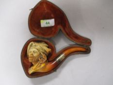 A 1930s carved Meerschaum pipe having HF silver marked to cuff of pipe, in original case.