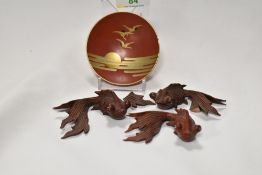 Three Japanese carved wood goldfish studies with a lacquer bowl