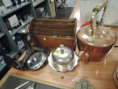 An Edwardian oak letter rack with brass trim, a silver plated muffin dish, a copper stove kettle and