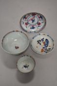 Four pieces of antique Oriental porcelain including tea bowl and saucer, small saucer and an Imari