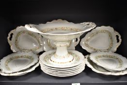 A late Victorian W. Ridgway Hanley dinner service having enamelled floral design 1096.