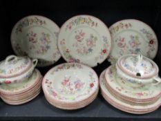 A collection of Royal Doulton dinner service having vibrant floral transfer pattern in pink. Blue,