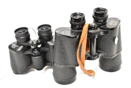 A pair of Cosmos 10x50 binoculars with a Halina Discovery 8x30 pair