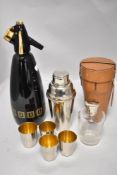 A portable cocktail mixer and shot set with a vintage soda syphon