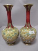 A pair of early 20th century Royal Doulton vases having textured lace effect finish to body,