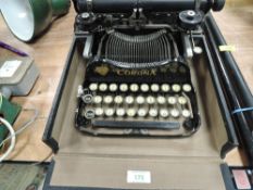 An early 20th century Corona typewriter no.3 with case and accessories