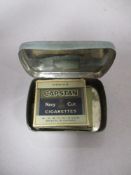 Two miniature packets of miniature plastic cigarettes, Capstan and Wild Woodbine.