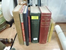 A selection of library books including the big book of gardening and Equine within
