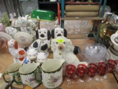 A group of Staffordshire Pottery Dogs and cats, graduated jug set and mixed glass wares