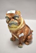 An antique Majolica tobacco jar in the form of a Pug dog, Lid having had repairs