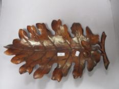 A large wood effect moulded oak leaf, can be used as a table decoration or hang on a wall.