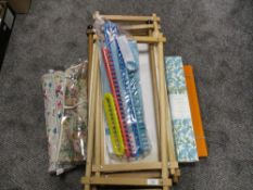 A selection of wool work embroidery and tapestry frames with accessories