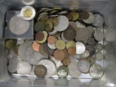 A mid century sandwich tin containing assorted collectable coins.