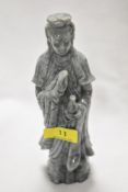 A carved natural stone temple Figurine.