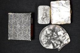 A Cornish pewter snuff box with a hound design, a Stratton musical compact case and a pewter dish