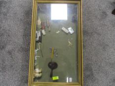 An early 20th century shop or counter top display case with some contents