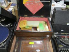 A Victorian casket form sewing case with mother of pearl inlay and a later 20th century sewing