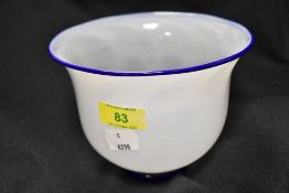A modern Lindean Mill art glass bowl having white body with Bristol blue rim and foot signed to base