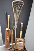 A selection of early 20th century sporting goods including Sykes cricket bat, tennis racket, golf