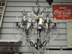 A set of modern wrought iron and lustre droplet ceiling and wall lights