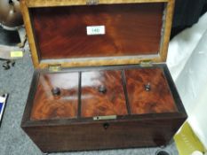 A Victorian casket form tea caddy having mahogany case with fitted interior
