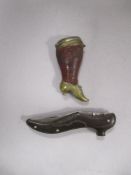 An antique brass and leather vesta case in the form of a Victorian shoe and leg, and a pocket