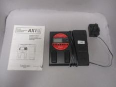 A modern Korg Toneworks guitar pedal with instructions