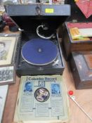 An early 20th century Columbia gramophone record player with a selection of 78rpm records