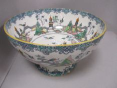 A large early 20th century Royal Doulton 'Birds of paradise' footed bowl, AF , damage to base.