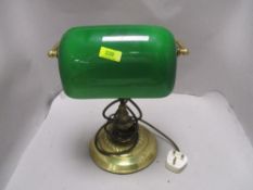 A brass effect and green glass desk/reading lamp
