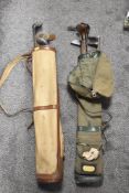 Two vintage canvas golf bags containing hickory shafted golf clubs, metal shafted golf clubs, carved