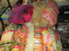 A selection of colourful theatrical or operatic garments, constructed with woven bands of