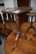 A 19th Century mahogany pedestal table having circular top, turned column and triple splay legs,