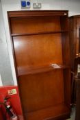 A reproduction mahogany tall bookcase, height approx. 194cm